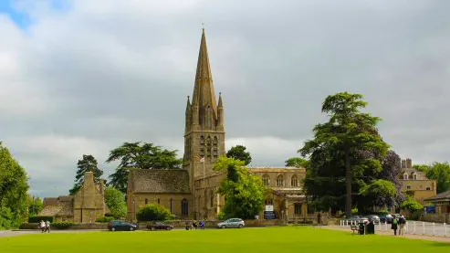 St Mary's Church on Church Green, Witney, with its tall spire behind the green